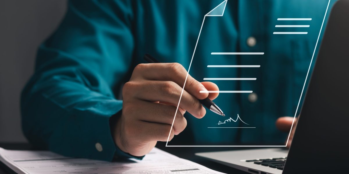 Electronic Signature Concept, Electronic Signing Businessman signs electronic documents on digital documents on virtual laptop screen.